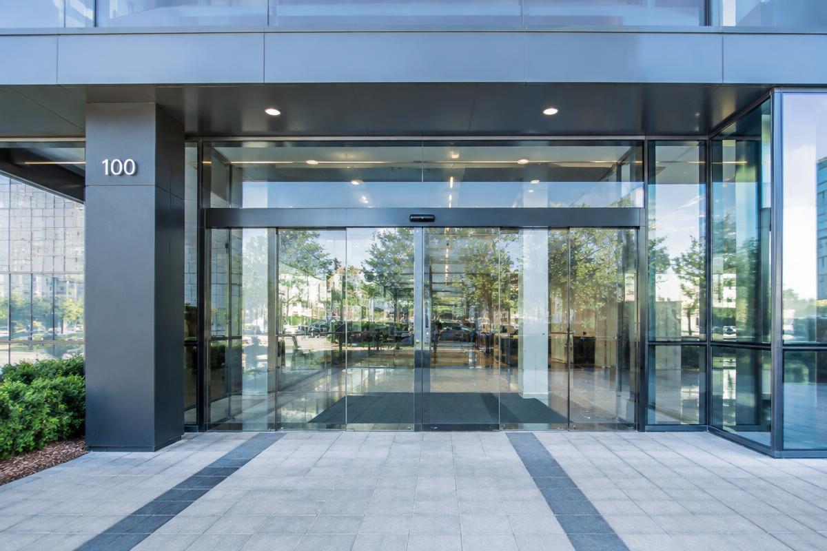 Commercial building entrance with large sliding glass doors